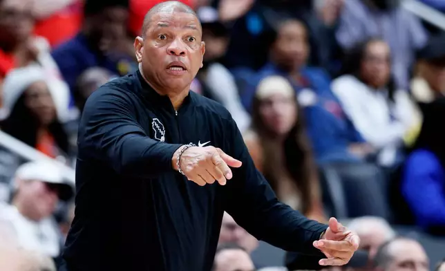 Milwaukee Bucks head coach Doc Rivers directs his payers against the Detroit Pistons during the first half of an NBA basketball game Wednesday, April 8, 2026, in Detroit. (AP Photo/Duane Burleson)