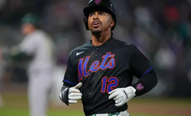 New York Mets' Francisco Lindor (12) reacts after being thrown out at first base during the eighth inning of a baseball game against the Athletics Friday, April 10, 2026, in New York. (AP Photo/Frank Franklin II)