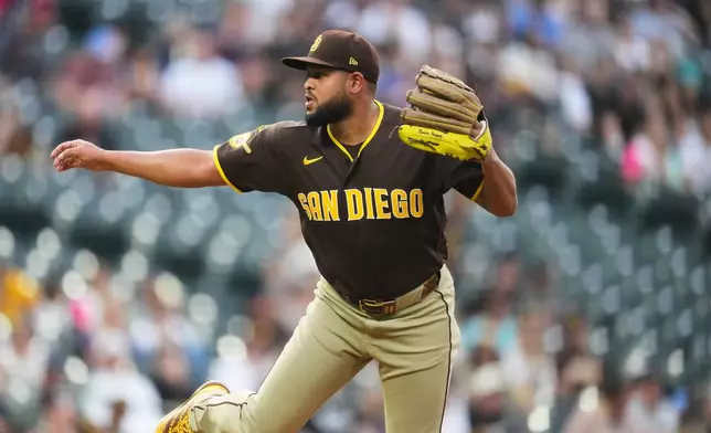San Diego Padres starting pitcher Randy V·squez works against the Colorado Rockies in the first inning of a baseball game Tuesday, April 21, 2026, in Denver. (AP Photo/David Zalubowski)