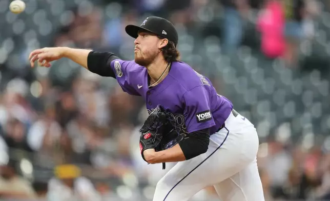 Colorado Rockies relief pitcher Chase Dollander works against the San Diego Padres in the second inning of a baseball game Tuesday, April 21, 2026, in Denver. (AP Photo/David Zalubowski)
