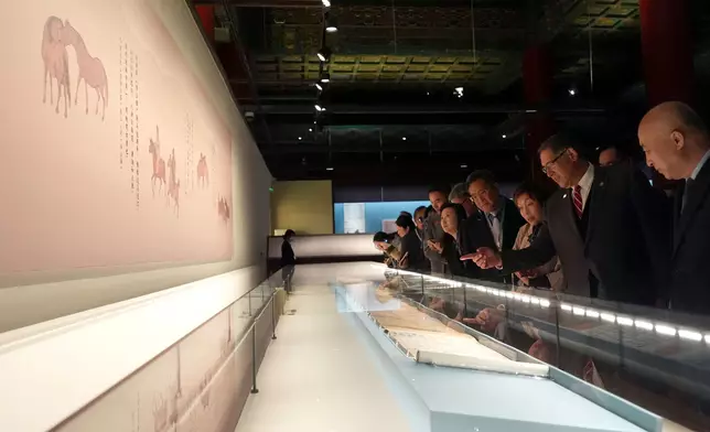 Guests tour the “Divine Steeds: Horses in Painting and Calligraphy of the Palace Museum” exhibition.