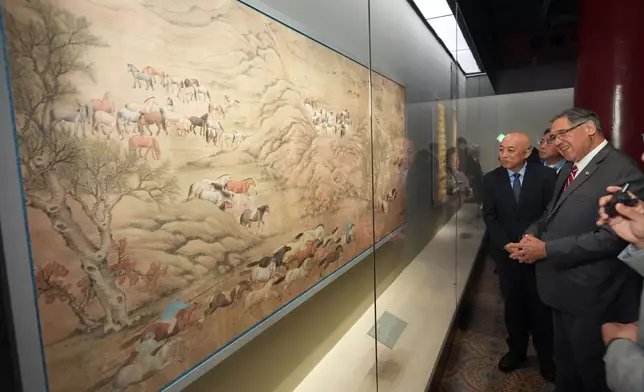 Guests tour the “Divine Steeds: Horses in Painting and Calligraphy of the Palace Museum” exhibition.