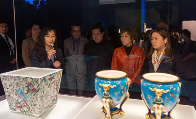 Guests tour the “Blooming: The Art of Gardens in East and West” exhibition.