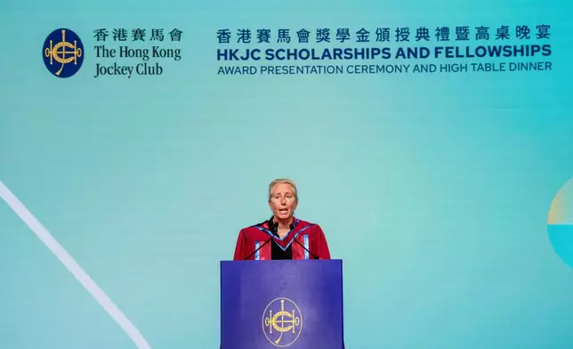 Keynote speaker Professor Anita Elberse congratulates awardees at The Hong Kong Jockey Club Scholarships and Fellowships Award Presentation Ceremony and High Table Dinner.