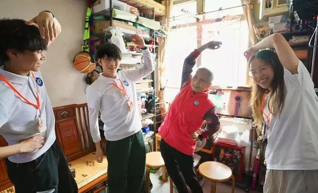 JC Scholar Sunny Wong (2nd left) and JC Scholar Winnie Pang (1st right) at a JC Scholar volunteer event.