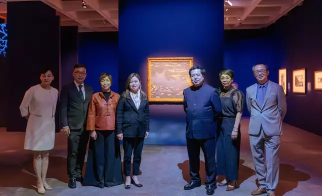 Guests tour the “Blooming: The Art of Gardens in East and West” exhibition.