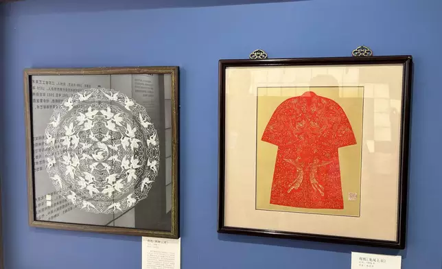 Staff explained that Yangzhou paper-cutting is characterized by "flat cutting, no folding, and asymmetry" — using ordinary scissors to cut directly through Xuan paper, producing smooth lines and a style quite different from northern window decorations. Photo by Bastille Post