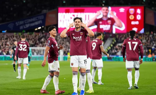 West Ham United's Konstantinos Mavropanos celebrates scoring their side's fourth goal of the game during their English Premier League soccer match against Wolverhampton Wanderers in London, Friday, April 10, 2026. (Jordan Pettitt/PA via AP)