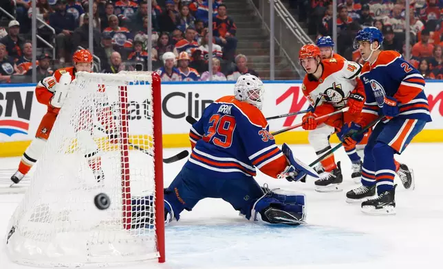 Anaheim Ducks' Beckett Sennecke (45) shoots against Edmonton Oilers' goaltender Connor Ingram (39) during the first period of Game 1 in a first-round NHL hockey Stanley Cup playoff series in Edmonton, Alberta, Monday, April 20, 2026. (Codie McLachlan/The Canadian Press via AP)