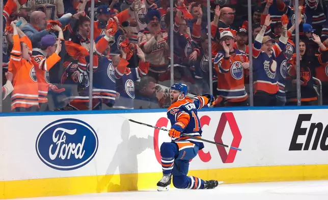 Edmonton Oilers' Jason Dickinson (16) celebrates after a goal against the Anaheim Ducks during the first period of Game 1 in a first-round NHL hockey Stanley Cup playoff series in Edmonton, Alberta, Monday, April 20, 2026. (Codie McLachlan/The Canadian Press via AP)