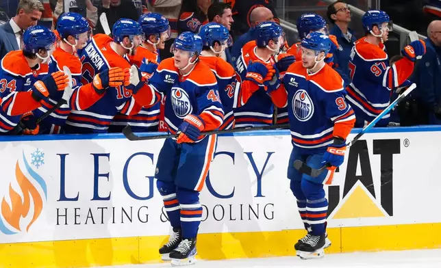Edmonton Oilers' Kasperi Kapanen (42) celebrates the game-winning goal against the Anaheim Ducks during the third period of an NHL playoff game in Edmonton on Monday, April 20, 2026. (Codie McLachlan/The Canadian Press via AP)