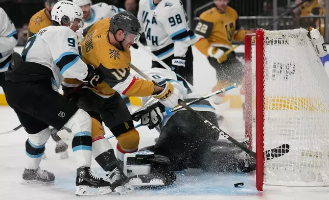 Vegas Golden Knights center Colton Sissons (10) scores against Utah Mammoth goaltender Karel Vejmelka (70) during the second period in Game 1 of a first-round NHL hockey Stanley Cup playoff series Sunday, April 19, 2026, in Las Vegas. (AP Photo/John Locher)