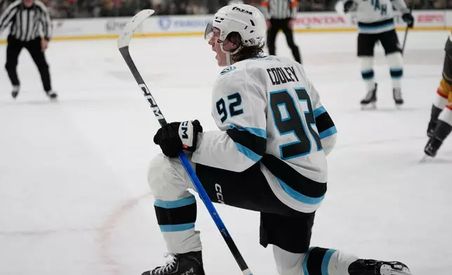 Utah Mammoth center Logan Cooley (92) celebrates after scoring against the Vegas Golden Knights during the first period in Game 1 of a first-round NHL hockey Stanley Cup playoff series Sunday, April 19, 2026, in Las Vegas. (AP Photo/John Locher)