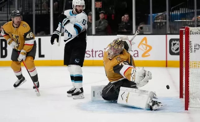 Vegas Golden Knights goaltender Carter Hart (79) is scored on by Utah Mammoth center Logan Cooley (92) during the first period in Game 1 of a first-round NHL hockey Stanley Cup playoff series Sunday, April 19, 2026, in Las Vegas. (AP Photo/John Locher)