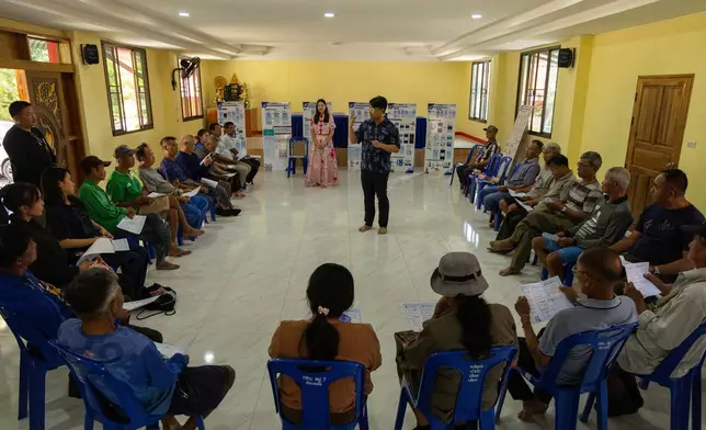 Thanapol Penrat, a professor with Naresuan University, hosts a fish safety app training session with fisherfolk in Chiang Saen, Thailand, Tuesday, Feb. 17, 2026. (AP Photo/Anton L. Delgado)