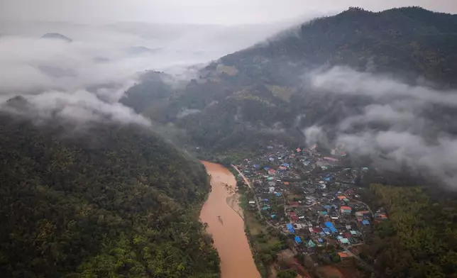 Mist covers the Thai village of Tha Ton, where the Kok River enters Thailand from Myanmar, on Feb. 20, 2026. (AP Photo/Anton L. Delgado)