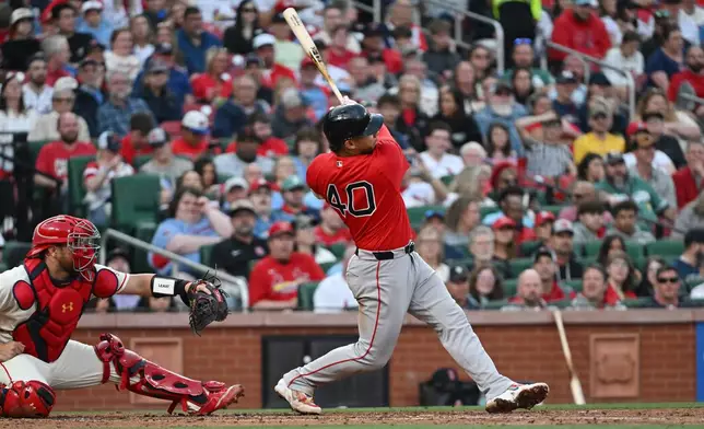Boston Red Sox's first baseman Willson Contreras (40) hits a two run RBI double during the fourth inning of a baseball game against the St. Louis Cardinals, Saturday, April 11, 2026, in St. Louis. (AP Photo/Michael Thomas)
