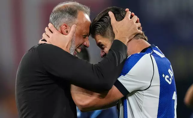 Real Sociedad's head coach Pellegrino Matarazzo, right, celebrates with Duje Caleta-Car after winning the Copa del Rey final soccer match between Atletico Madrid and Real Sociedad in Seville, Spain, Saturday, April. 18, 2026. (AP Photo/Jose Breton)