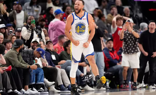 Golden State Warriors guard Stephen Curry celebrates after scoring during the second half of an NBA play-in tournament basketball game against the against the Los Angeles Clippers, Wednesday, April 15, 2026, in Inglewood, Calif. (AP Photo/Mark J. Terrill)