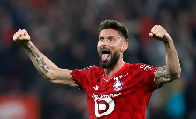 Lille's Olivier Giroud celebrates at the end of the French League One soccer match between Lille and Lens, in Lille, France, Saturday, April 4, 2026. (AP Photo/Jean-Francois Badias)