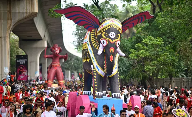 People participate at the Baishakhi Shobhajatra procession to celebrate the first day of the Bangla New Year in Dhaka, Bangladesh, Tuesday, April 14, 2026. (AP Photo/Mahmud Hossain Opu)