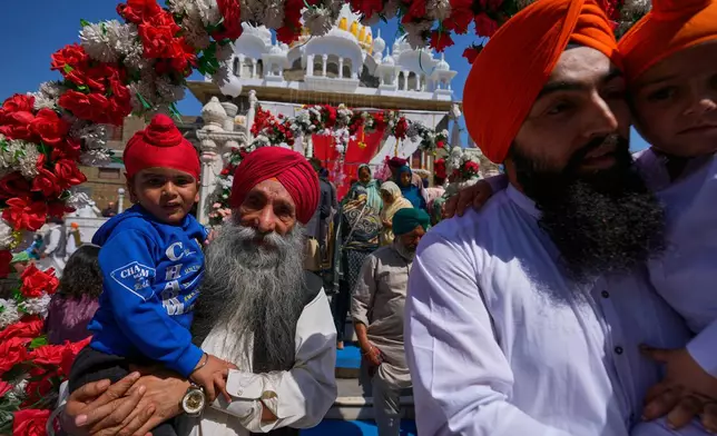 Sikh pilgrims attend a ceremony to celebrate Vaisakhi festival, which also marks the New Year in Sikh tradition, at the shrine of Gurdwara Punja Sahib, the second most sacred place for Sikhs, in Hassan Abdal, Pakistan, Tuesday, April 14, 2026. (AP Photo/Anjum Naveed)