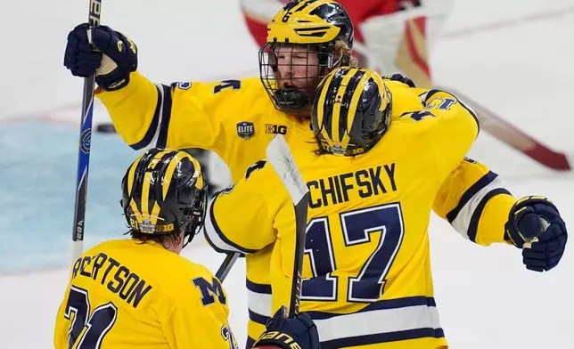 Michigan forward Josh Eernisse (6) celebrates after scoring against Denver in the first period of a semifinal game of the NCAA Frozen Four men's college hockey tournament Thursday, April 9, 2026, in Las Vegas. (AP Photo/John Locher)