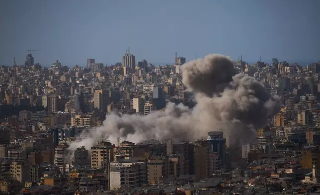 Smoke rises from Israeli airstrikes in Dahiyeh, a southern suburb of Beirut, Lebanon, Sunday, April 5, 2026. (AP Photo/Emilio Morenatti)