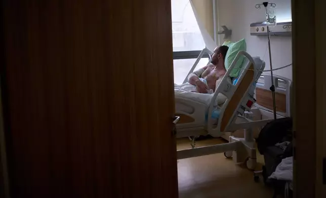 A man with burn wounds from an Israeli airstrike on southern Lebanon lying in bed at the Sidon Government Hospital in Sidon, Lebanon, Thursday, April 2, 2026. (AP Photo/Emilio Morenatti)