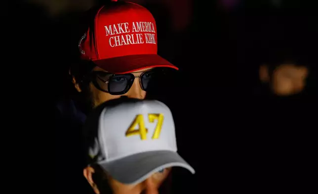 People listen as Vice President JD Vance speaks at a Turning Point USA tour stop at the University of Georgia in Athens, Ga., Tuesday, April 14, 2026. (AP Photo/Erik S. Lesser)