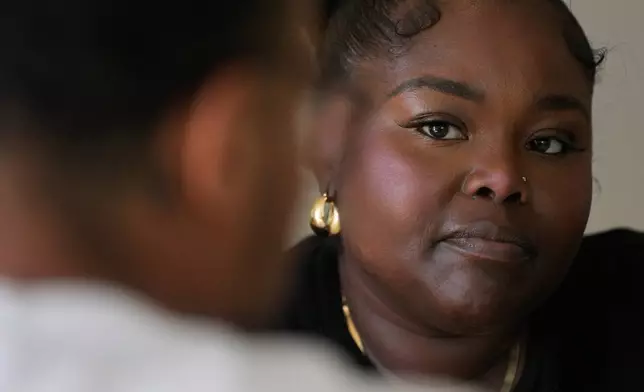 Oakland Ceasefire-Lifeline life coach LaSasha Long, right, talks to Bernard C. during an interview Thursday, April 23, 2026, in Oakland, Calif. (AP Photo/Jeff Chiu)