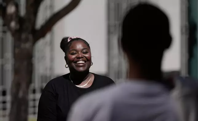 Oakland Ceasefire-Lifeline life coach LaSasha Long, left, laughs with Bernard C. during an interview Thursday, April 23, 2026, in Oakland, Calif. (AP Photo/Jeff Chiu)