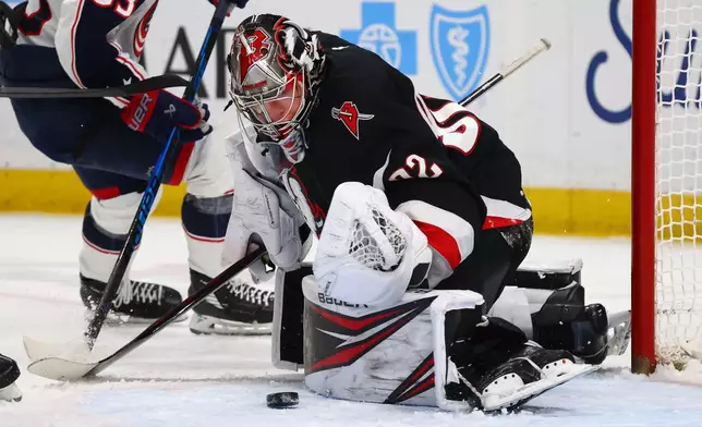 Buffalo Sabres goaltender Colten Ellis (92) makes a save during the second period of an NHL hockey game against the Columbus Blue Jackets, Thursday, April 9, 2026, in Buffalo, N.Y. (AP Photo/Jeffrey T. Barnes)