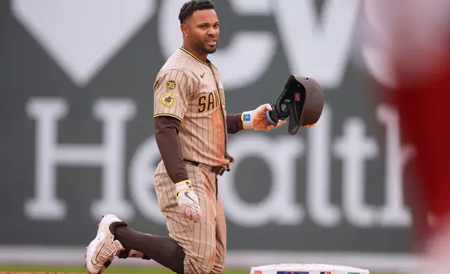 San Diego Padres shortstop Xander Bogaerts (2) reacts after being tagged out after trying to advance to second base during the second inning of a baseball game against the Boston Red Sox, Sunday, April 5, 2026, in Boston. (AP Photo/Robert F. Bukaty)