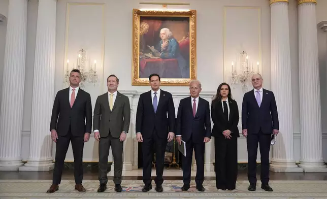 From left, Michael Needham, counselor for the U.S. Dept. of State, U.S. Ambassador to the United Nations Mike Waltz, Secretary of State Marco Rubio, U.S. Ambassador to Lebanon Michel Issa, Lebanese Ambassador to the U.S. Nada Hamadeh Moawad, and Israeli Ambassador to the U.S. Yechiel Leiter pose for a photo before a meeting at the State Department in Washington, Tuesday, April 14, 2026. (AP Photo/Jacquelyn Martin)
