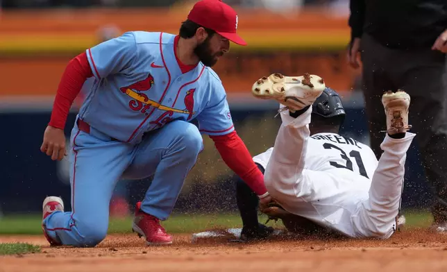 St. Louis Cardinals second baseman Thomas Saggese (25) tags Detroit Tigers' Riley Greene (31) out attempting to steal second basein the first inning of a baseball game Saturday, April 4, 2026, in Detroit. (AP Photo/Paul Sancya)