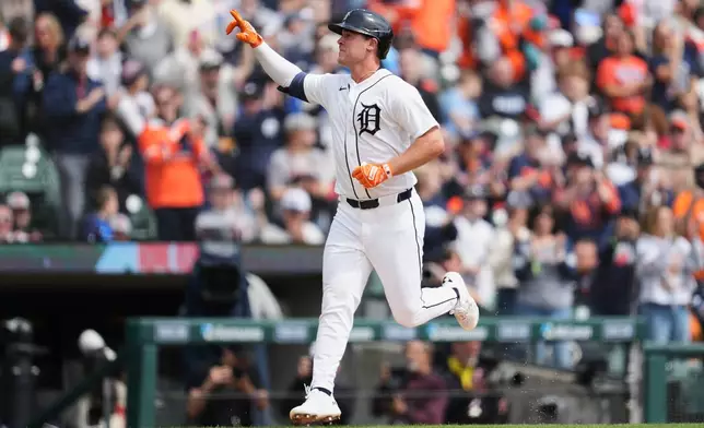 Detroit Tigers' Kerry Carpenter reacts to his two-run home run against the St. Louis Cardinals in the first inning of a baseball game Saturday, April 4, 2026, in Detroit. (AP Photo/Paul Sancya)
