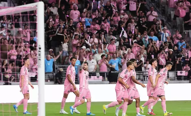 Inter Miami forward Lionel Messi, third left, celebrates with teammates after scoring a goal against Austin FC during the first half of an MLS soccer match, Saturday, April 4, 2026, in Miami. (AP Photo/Rebecca Blackwell)