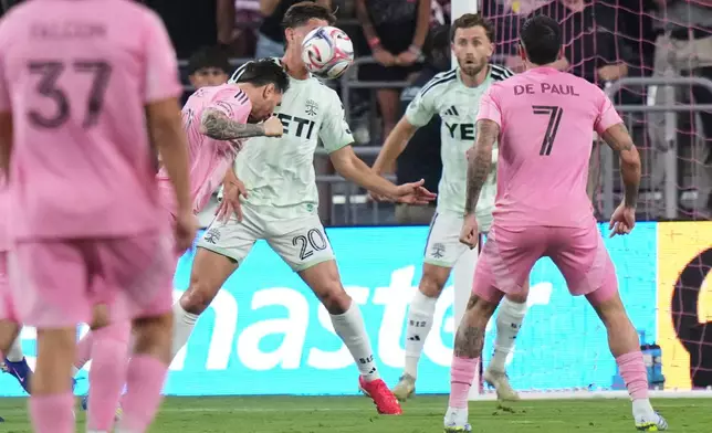 Inter Miami CF forward Lionel Messi, left scores a goal during the first half of an MLS soccer match against Austin FC, Saturday, April 4, 2026, in Miami. (AP Photo/Lynne Sladky)
