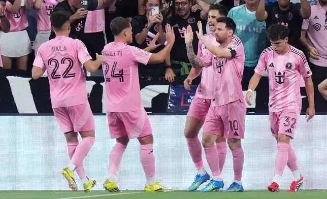 Inter Miami CF forward Lionel Messi, second from right, celebrates after scoring a goal during the first half of an MLS soccer match against Austin FC, Saturday, April 4, 2026, in Miami. (AP Photo/Lynne Sladky)