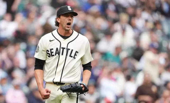 Seattle Mariners starting pitcher Logan Gilbert reacts after Houston Astros' Isaac Paredes hit into a double play to end the top of the sixth inning of a baseball game, Sunday, April 12, 2026, in Seattle. (AP Photo/Lindsey Wasson)