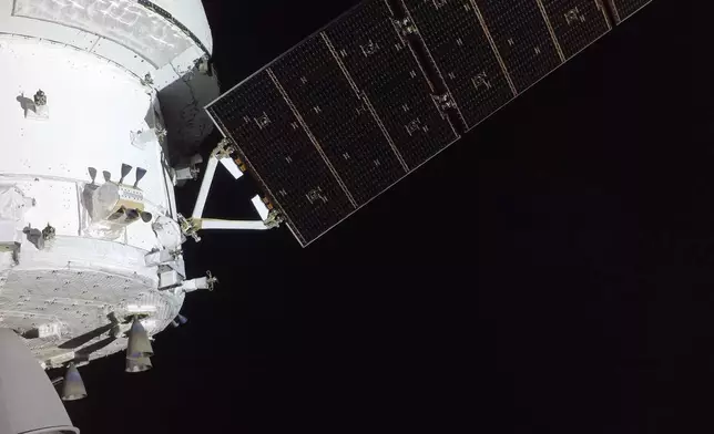 In this image provided by NASA, the Artemis II crew captured this image of Orion spacecraft pictured from one of the cameras mounted on its solar array wings on Tuesday, April 7, 2026. (NASA via AP)