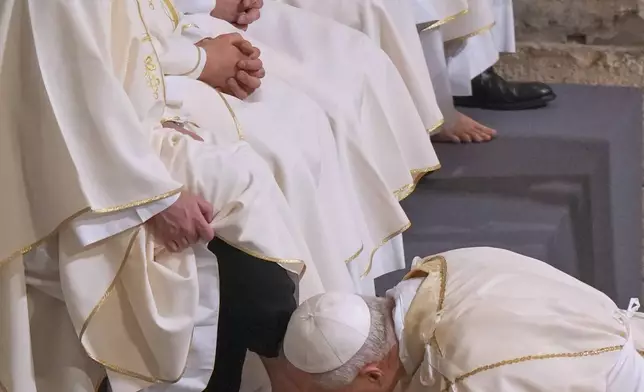 Pope Leo XIV washes and kisses the feet of 12 Roman priests during the Missa in Caena Domini, the Mass of the Lord's Supper, on Catholic Holy Thursday in St. John Lateran Basilica in Rome, Thursday, April 2, 2026. (AP Photo/Andrew Medichini)