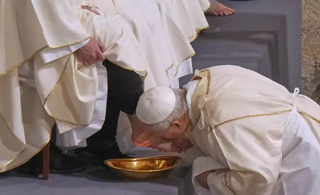 Pope Leo XIV washes and kisses the feet of 12 Roman priests during the Missa in Caena Domini, the Mass of the Lord's Supper, on Catholic Holy Thursday in St. John Lateran Basilica in Rome, Thursday, April 2, 2026. (AP Photo/Andrew Medichini)
