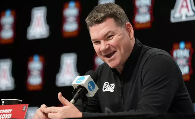 Arizona head coach Tommy Lloyd speaks during a news conference ahead of a national semifinal NCAA college basketball tournament game against Michigan at the Final Four, Thursday, April 2, 2026, in Indianapolis. (AP Photo/Abbie Parr)