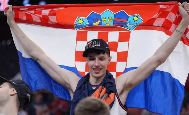 Illinois' Zvonimir Ivisic celebrates after an Elite Eight game against Iowa in the NCAA college basketball tournament Saturday, March 28, 2026, in Houston. (AP Photo/Eric Gay)
