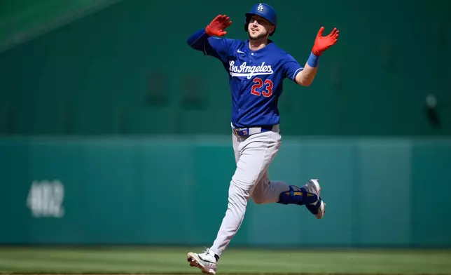 Los Angeles Dodgers' Kyle Tucker celebrates his home run as he rounds the bases during the seventh inning of a baseball game against the Washington Nationals, Friday, April 3, 2026, in Washington. (AP Photo/Nick Wass)