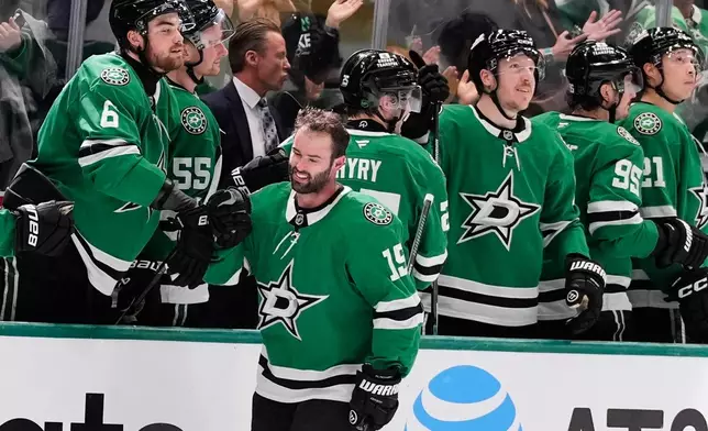 Dallas Stars center Colin Blackwell (15) celebrates with teammates after scoring against the Minnesota Wild in the second period of an NHL hockey game Thursday, April 9, 2026, in Arlington, Texas. (AP Photo/Tony Gutierrez)
