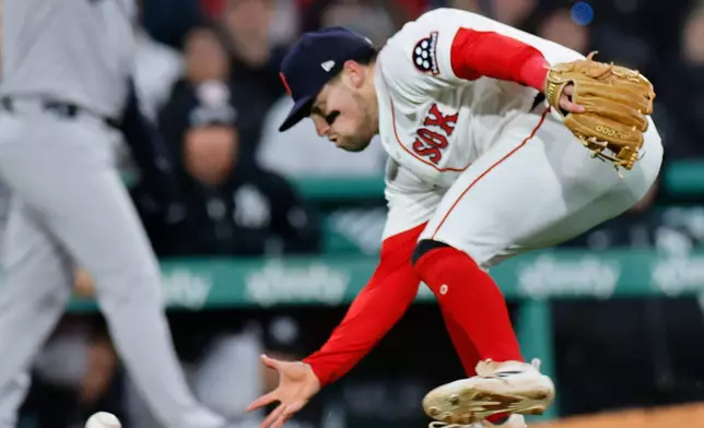 Boston Red Sox third baseman Caleb Durbin fields the ball during the sixth inning of a baseball game against the New York Yankees on Tuesday, April 21, 2026, in Boston. (AP Photo/CJ Gunther)