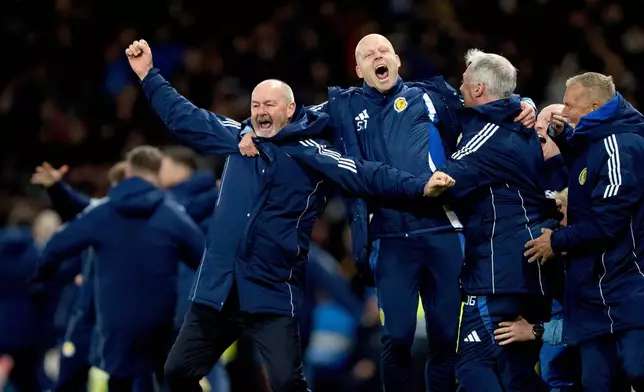 FILE - Scotland's bench and head coach Steve Clarke, left, react after the 2026 World Cup European Qualifying soccer match between Scotland and Denmark at Hampden Park, Glasgow, Scotland, Tuesday, Nov. 18, 2025. (Bo Amstrup/Ritzau Scanpix via AP, File)
